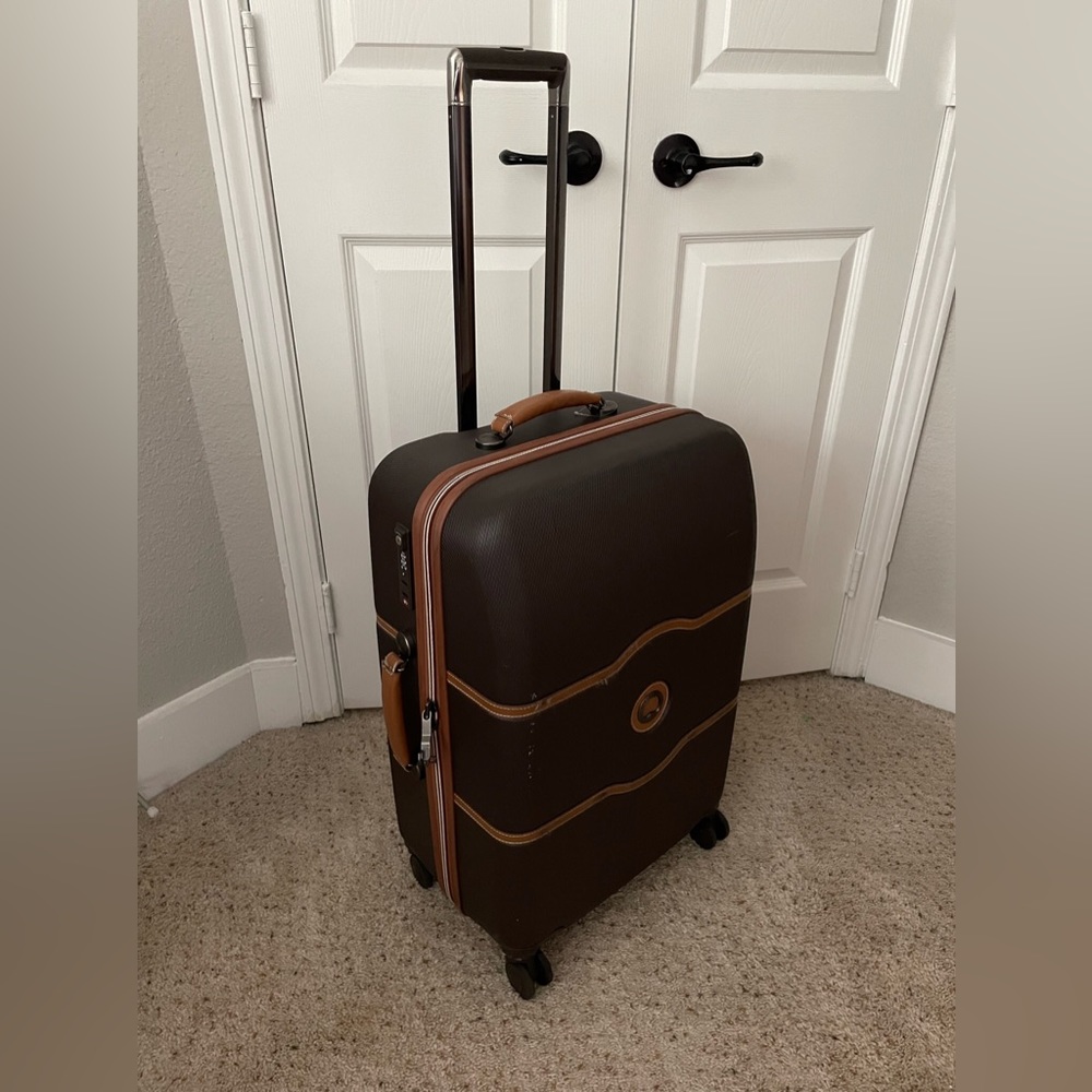 Delsey 24” spinner luggage suitcase used once brown